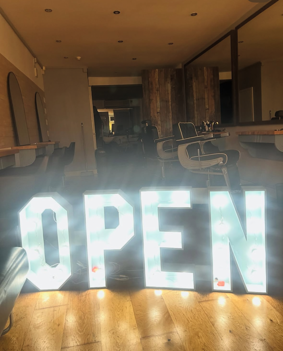 Illuminated OPEN sign inside the shop
